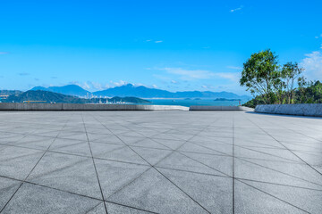 Obraz premium Empty square floor and coastline with island natural landscape under blue sky. Outdoor natural background.