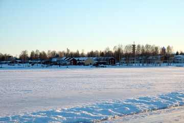 Snow-covered landscape in Mora, Dalarna showcasing winter tranquility near Leksand