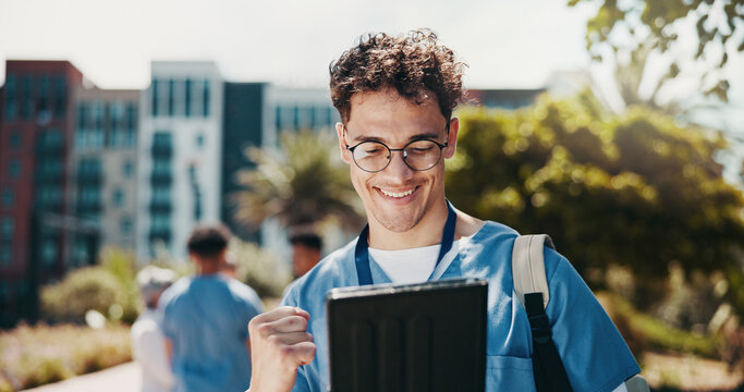 Happy man, nurse or medical student with tablet for good news, winning or achievement at med school. Male person, healthcare intern or candidate with smile on technology for results or pass at campus