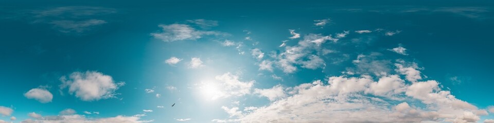 Fototapeta premium Sky 360 panorama - Bright blue sky filled with fluffy white Cirrus clouds. Seamless hdr spherical 360 panorama. Sky dome sky replacement for aerial drone 360 panoramas. Weather and climate change