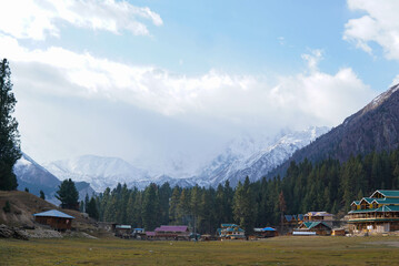 Snowy Nanga Parbat reflects perfectly in a calm lake at Fairy Meadows, Pakistan. 