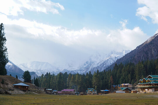 Snowy Nanga Parbat reflects perfectly in a calm lake at Fairy Meadows, Pakistan. 