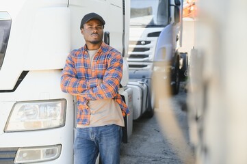 Professional truck driver Standing in front of the semi truck.