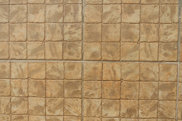 Close shot of stone like beige embossed ceramic tiles