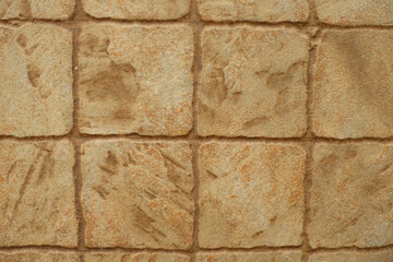 Macro of stone like beige embossed ceramic tiles