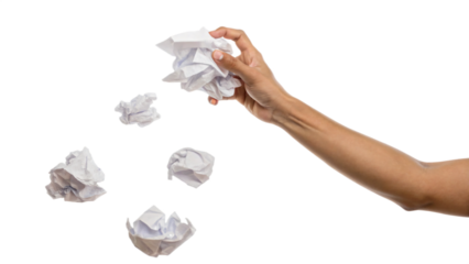 hand throwing crumpled paper