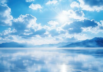 Obraz premium Bright Blue Sky Over Calm Water with Distant Mountains and Clouds