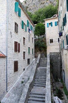 Kotor's narrow cobblestone streets and historic stone houses, a UNESCO World Heritage site. City ​​architecture details.	