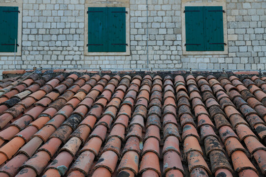 Old rusty and dirty Ceramic Roof tile, old and damaged and worn out roofing material