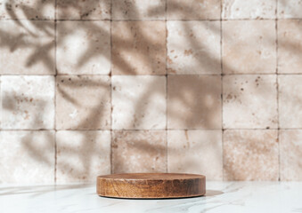 Round Wooden Tray Pedestal on Bathroom Shelf with Travertine Tile Background and Leaf Shadows....