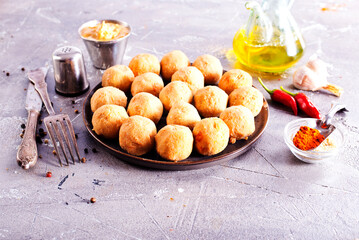 Fresh falafel balls on a black plate