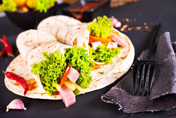 Shawarma sandwich, fresh roll of lavash (pita bread) pork shawarma with ham and cheese