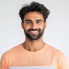 Obraz premium young handsome man in t shirt holding laptop