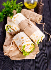 Shawarma sandwich, fresh roll of lavash (pita bread) pork shawarma with ham and cheese