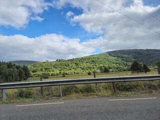 Highway and green hills of Ireland, beautiful landscapes