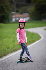 beautiful girl playing with her skateboard