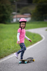 beautiful girl playing with her skateboard
