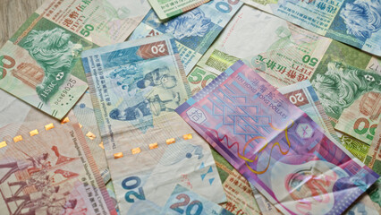 Fototapeta premium Scattered hong kong dollar banknotes showcasing colorful currency design in a close-up view with no people in the scene