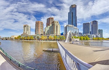 Naklejka premium Yarra River and Melbourne skyline, blending architecture and nature in harmony