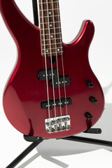 Closeup photo of a white bass guitar