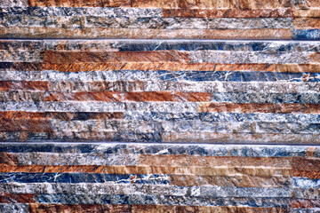 Striped abstract orange brown blue wall. Decor, backdrop
