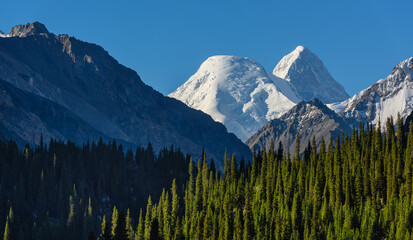View of the Khan Tengri peak in the Northern Tien Shan, the height of which with ice cover is 7010 meters. At the top of the peak the borders of China, Kazakhstan and Kyrgyzstan meet