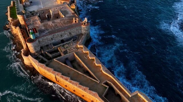 revealing shot of Syracuse in Sicily, Italy, aerial view, flying above Sicilian city of Syracuse at sunset, travel in Sicily, Mediterranean resort town