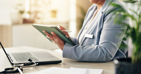 Doctor, hands or tablet in office for healthcare, online consultation or medical research at laptop. Woman, specialist or tech in practice on telehealth app, insurance registration and communication