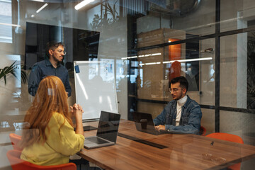 Business team collaborating on project in modern office meeting room