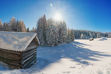 The new deep snow on the wall in the mountains, a walk in the sun and snow.