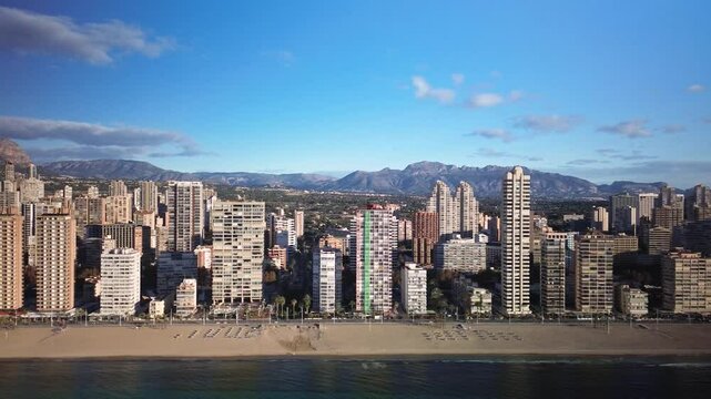 Panning along the Levante Beach Benidorm  early in the morning.