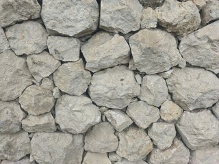 Obraz premium Background texture of white rough stone wall