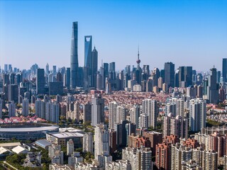Fototapeta premium The drone aerial view of residential district in Pudong with skyscrapers in the background, Shanghai, China.