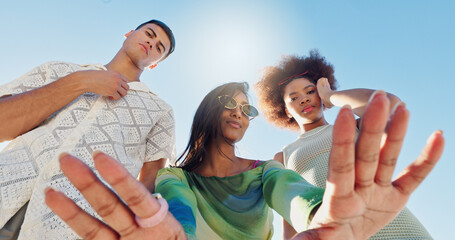 Friends, selfie and gen z people in low angle, blue sky or fashion with attitude for portrait in...