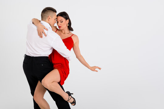 Photo of two passionate dancing partners hug perform empty space isolated on white color background