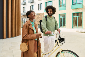 Smiling Friends Chatting While Walking with Bicycle