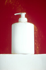 Festive beauty product. a minimalist white pump bottle on red background. Valentine's day. Perfect for holiday skincare, Christmas advertising, or luxury beauty. Winter-themed promotion. Gift.