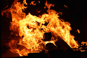 fire in the fireplace, Close-up of fire flames against a black background, Fire flames, burning wood