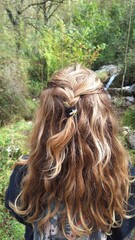 girl with hair in the mountains