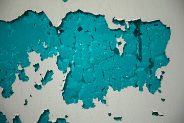 Dry paint on the wall. Scuffed wall. Texture of blue.