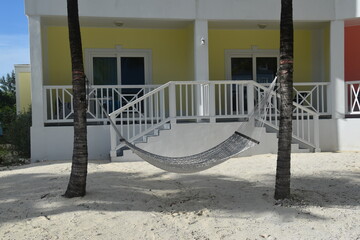 Hammocks between two palm trees on a paradise island beach