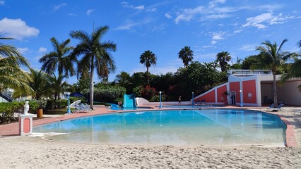 A cute colonial inspired hotel exterior design with pastel  colours by the Caribbean sea in Bahamas