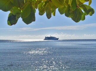 Cruising the Fiji Islands in the Pacific Ocean in a large white luxury Yacht
