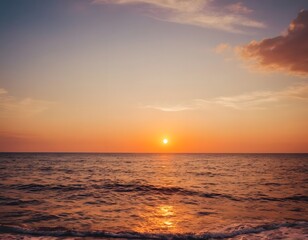 Fototapeta premium orange sunset over the sea beautiful reflection of sun light on the sea water