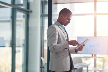 Fototapeta premium Businessman, investor or browsing with tablet for corporate performance or data analysis at office. Man, employee or financial analyst with technology or app for company report, progress or review