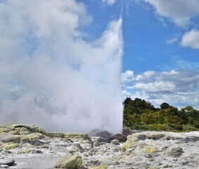 An exploding geyser with a lot of mist and smoke