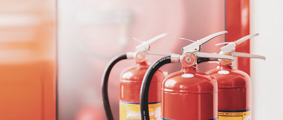The red fire extinguisher is ready for use in case of an indoor fire emergency.	