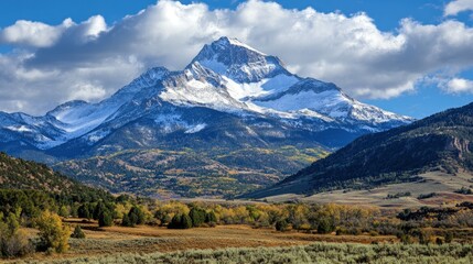 Fototapeta premium Snow-capped mountain, autumn valley, vibrant colors.