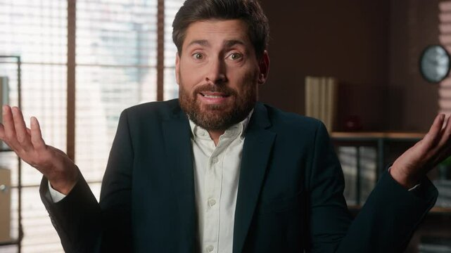 Portrait at office confused uncertain Caucasian man business male company worker problem trouble bad businessman guy looking at camera spread hands shrug shoulder unsure hesitate shrugging ignorance