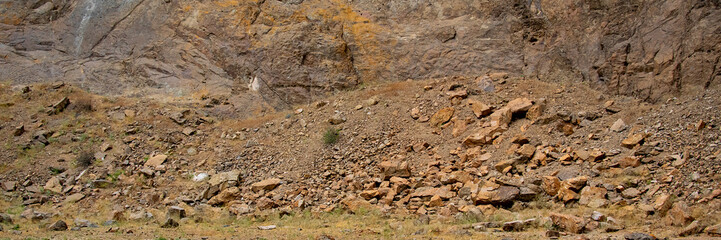 Dry arid ground and base of rocky mountain, piedra parada, patagonia, argentina